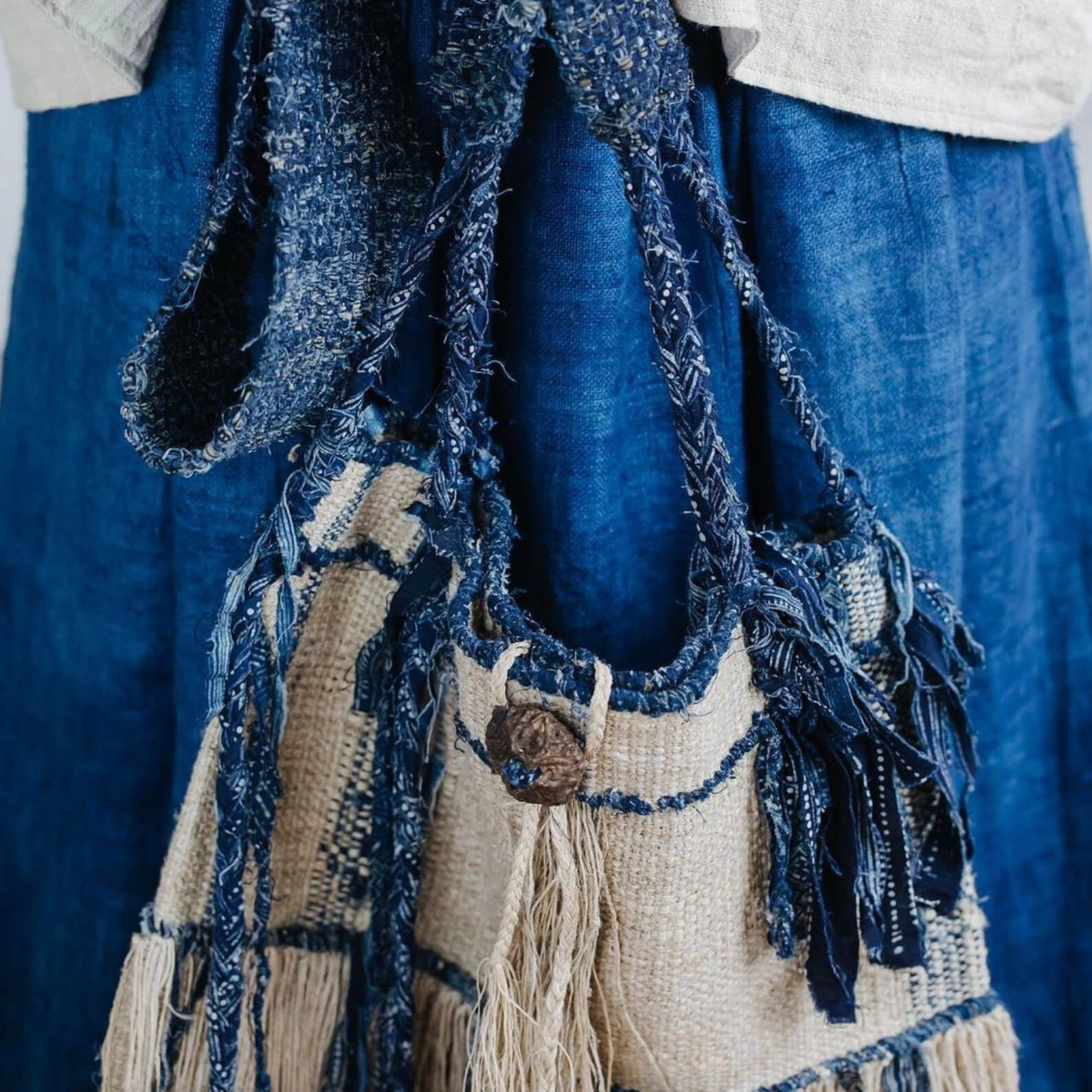 This antique Hmong Batik shoulder bag is one out of twelve pieces exclusively designed by Kachama Perez for the Raya Curated Collection. Inspired by the artist’s own intuition, coupled with her deep-rooted appreciation for the weaving and dyeing techniques of the hill tribe people, this one-of-a-kind piece is a celebration of traditional craftsmanship, yet unbounded by conventional art forms.