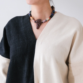 Hand carved mountain jasper with tribal face, green agate, lapis, coral & natural mountain, and sea stones, denim fabric